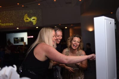 Women taking a photo at prom