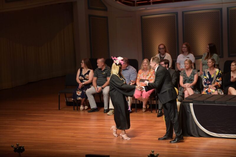 Student receiving her diploma