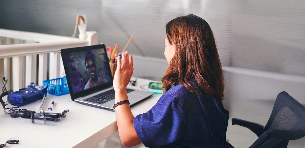 Girl saying hi to virtual class