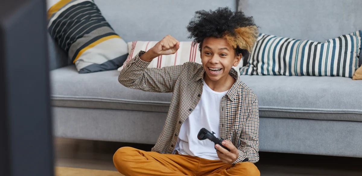 boy playing videogames