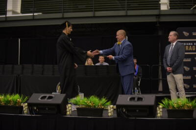 People meeting hands on a graduation