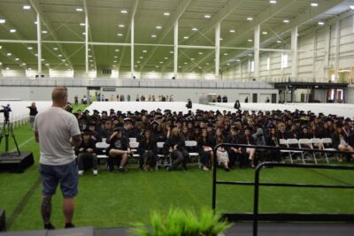 A room full of people that will graduate