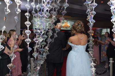 People arriving at their prom party