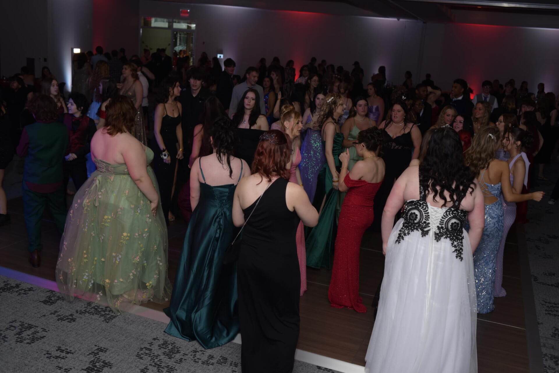 girls wearing beautiful long dressed at prom