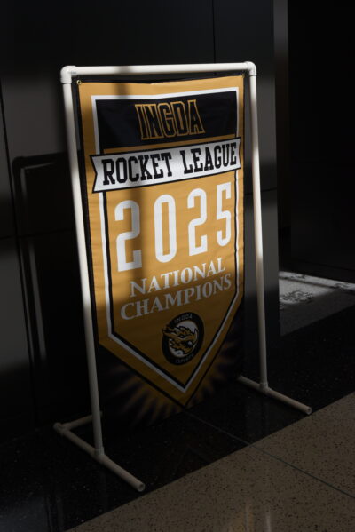 Banner celebrating the 2025 National Champions of the Rocket League, featuring the INGDA esports logo and vibrant colors.