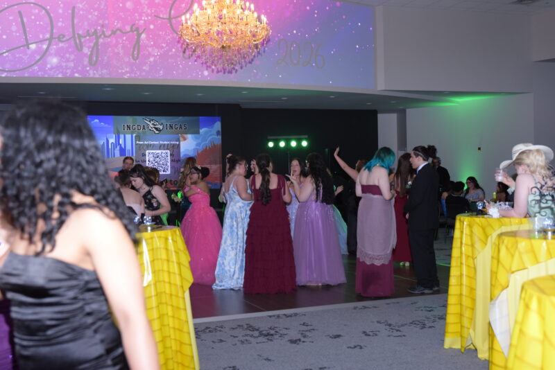 group of girls dancing at the prom