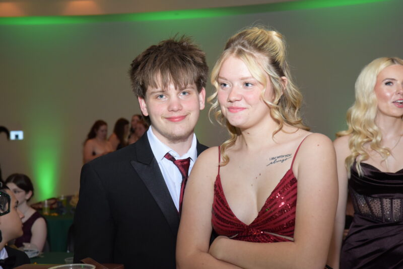 students with formal dresses at the prom