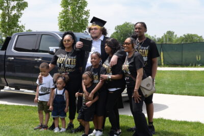 boy with his family smiling