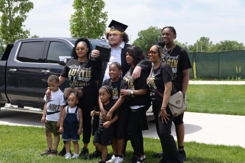 boy with his family smiling