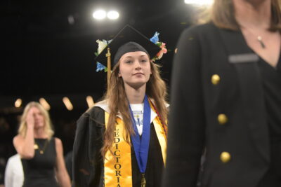 student walking and smiling