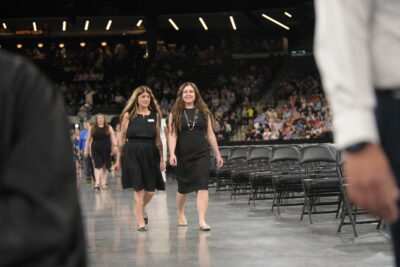 students walking for diplomas