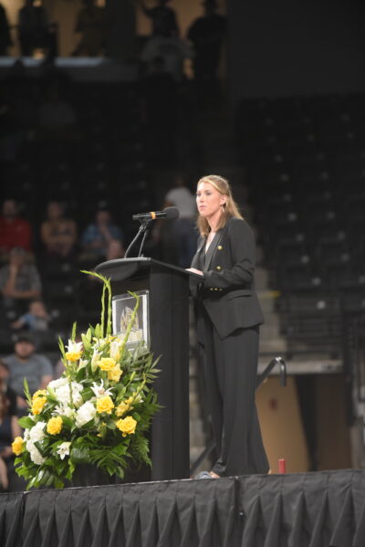 one of directors speaking at graduation